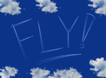 Fly inscription on a blue sky, line of aircraftの写真素材