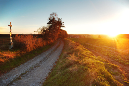 sunset by the wayside, pious, spiritual moodの写真素材