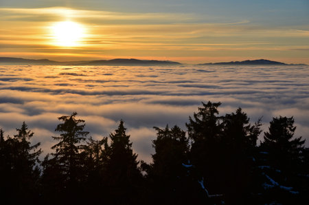 view of the sunset above the clouds