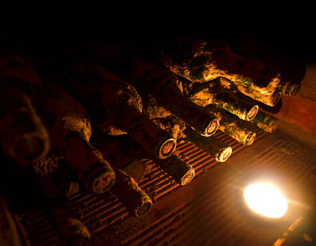vintage wines in the wine cellar, bottles of old winesの写真素材
