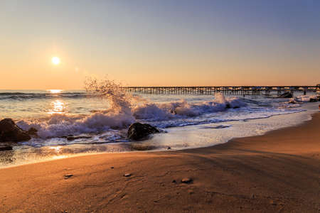 Winter sunrise on the beachの写真素材