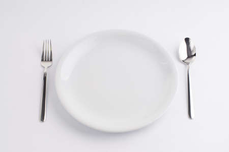 Silverware and china plateの写真素材