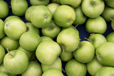 Green Apples on Market Stall Ready For Saleの写真素材