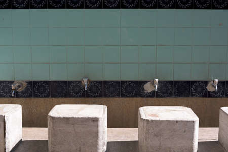 Faucets and Stones in Garden of Mosque For Ablutionsの写真素材