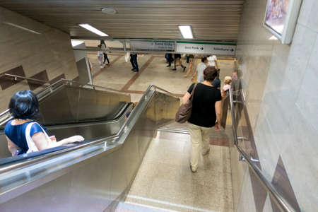People Trying Not To Miss Subway Using Stairs in Stationのeditorial素材