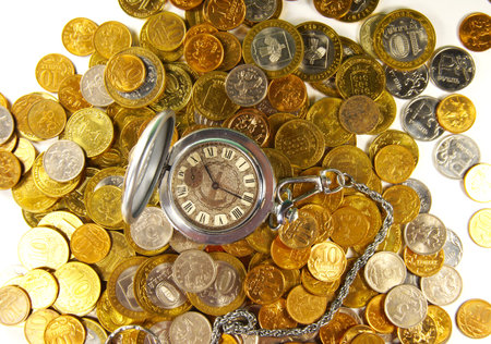 concept ruble coins with a clock on top of a light background