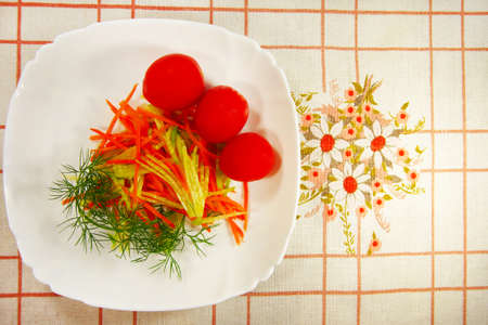fresh lettuce and tomatoes on a cloth backgroundの写真素材