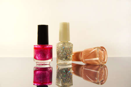 Group of the nail polish on mirror surfaceの写真素材