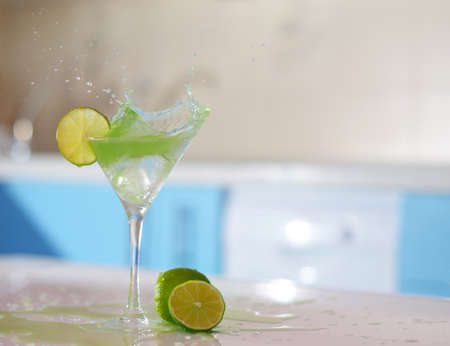 splash in glass of margarita on the barの写真素材