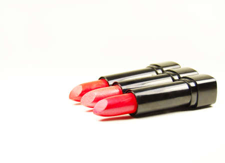 three beautiful lipsticks isolated on the whiteの写真素材
