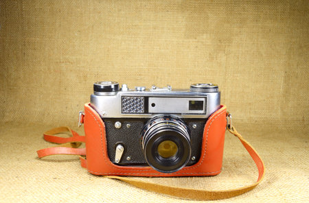 old vintage camera closeup on canvas background