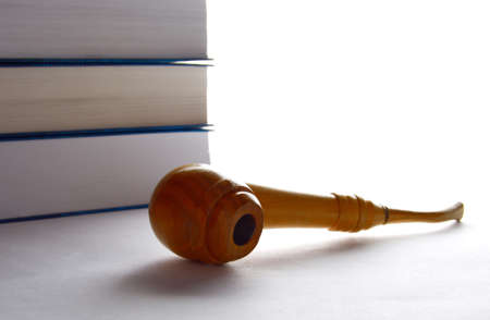 tobacco pipe and a stack of booksの写真素材
