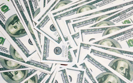 a motley background of the dollar bills