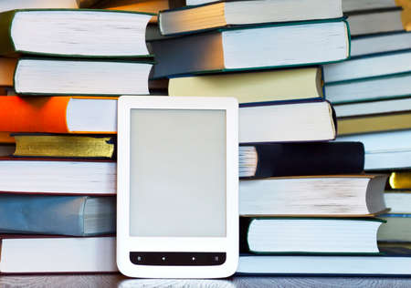 white laptop on the stack book backgroundの写真素材