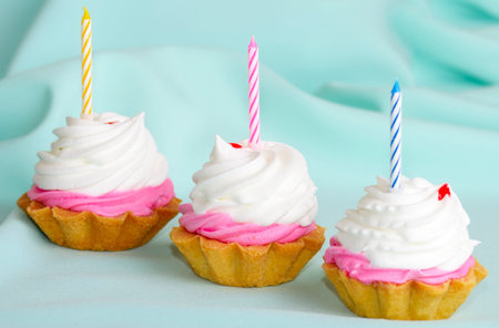 Cream cake with candles on the birthdayの写真素材