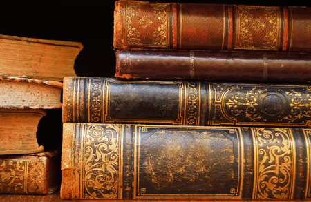 antique books on a shelf macroの写真素材