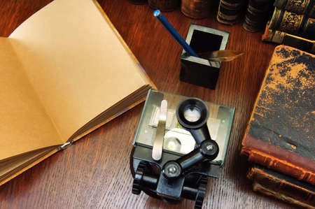 Microscope and the ancient scientific booksの写真素材