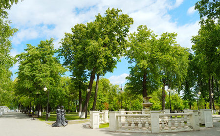 Alley and the old fountain in the park, Tyumenの写真素材