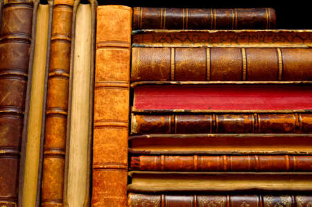 stack of vintage books on the shelvesの写真素材
