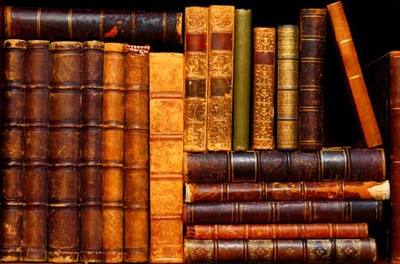 Books on a shelf in the antique cabinetの写真素材