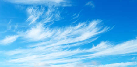 Blue sky with a light cirrus cloudsの写真素材