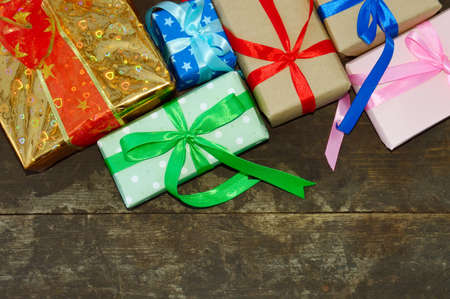 Christmas gift boxes on wooden backgroundの写真素材