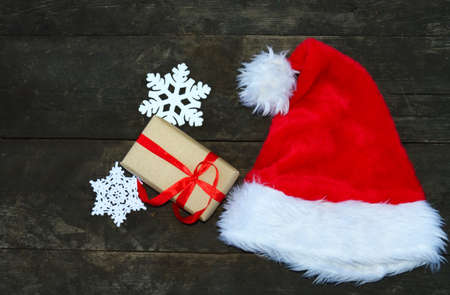 Christmas theme. Santa hat on wooden tableの写真素材