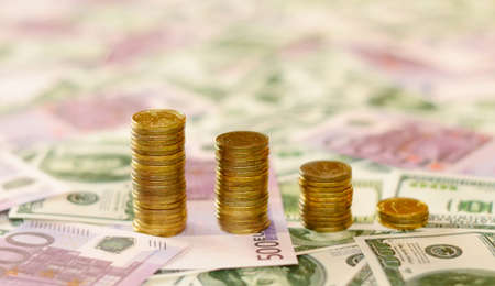 stacks of coins on the money backgroundの写真素材