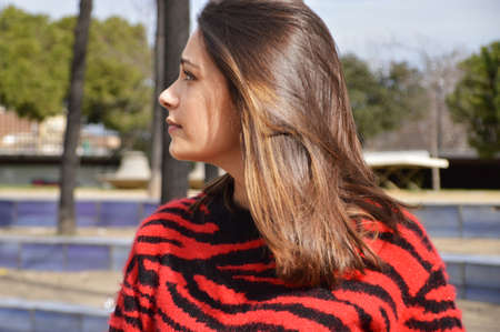 Young girl side face in the parckの写真素材