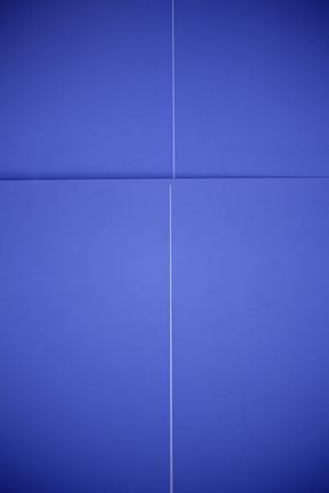Blue wall background with shadows, lightingの写真素材