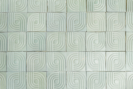 Tiles with circles and lines on building wallの写真素材