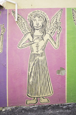 Graffiti urban angel with wings on wall, symbolのeditorial素材