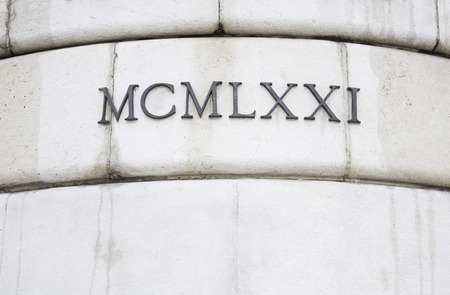 Roman numerals in historic building architectureの写真素材