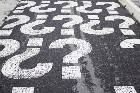 Question marks on urban street, symbolの写真素材