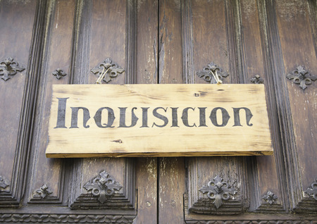 Wooden signboard Inquisition in old buildingの写真素材