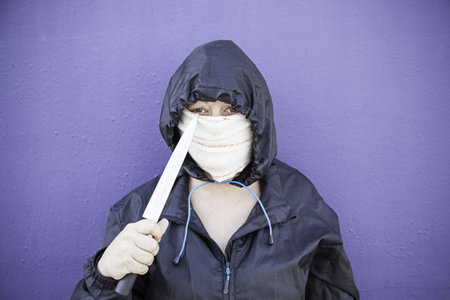 Aggressive hooded woman, violence and lifestyleの写真素材