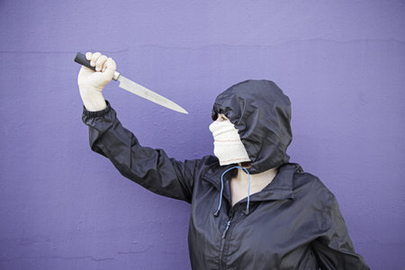 Aggressive hooded woman, violence and lifestyleの写真素材