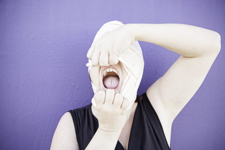 Woman pulling headband with anxiety, fear and conditionの写真素材