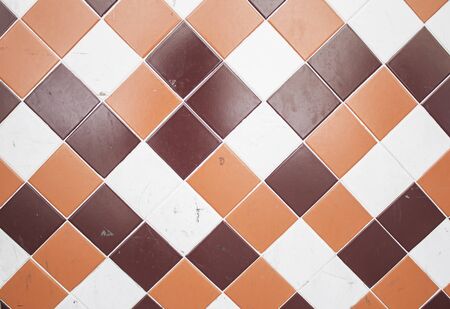Orange and red tiled urban wall decorationの写真素材