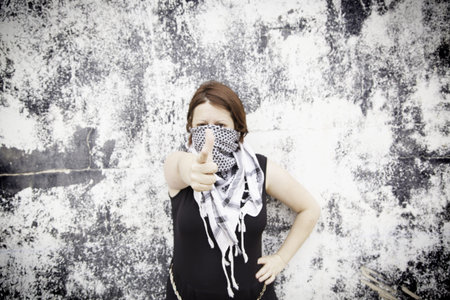 Palestinian woman with scarf on urban street