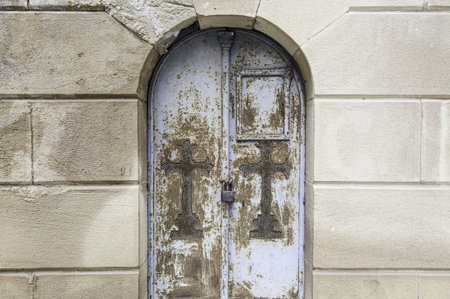 Rusty metal door and broken cemetery, religion