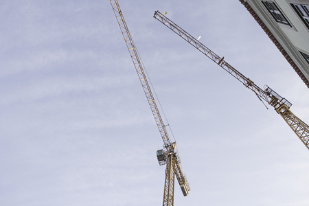Construction cranes in urban city, architectureの写真素材