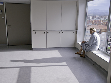 Sick woman in bed hospital, disease and infectionの写真素材