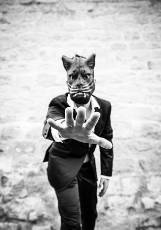 Male black cat mask, fear and terrorの写真素材