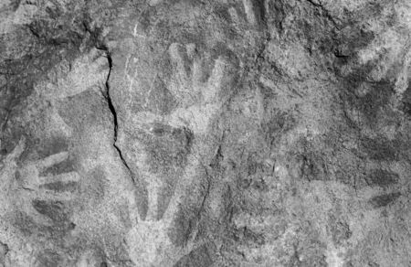 Handprints on painted rocks, symbol and texturesの写真素材