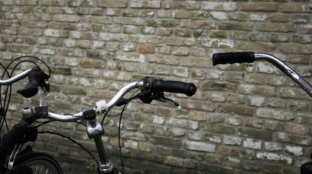 Typical bicycles parked in Holland, transport detail in the city, tourism in europeの写真素材
