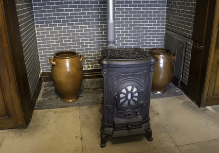 Old iron stove in home, winter and heatの写真素材
