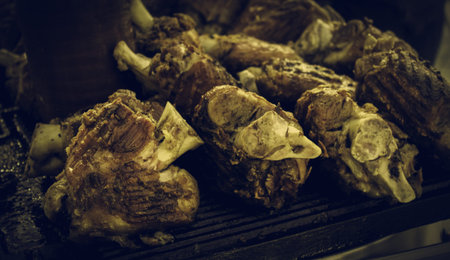 Meat on the grill, roasting meat on an ember with fireの写真素材