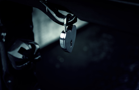 Padlock hanging on bridge, symbol of love, unionの写真素材