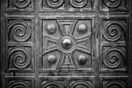 Wooden door with carved religious cross, building and architectureの写真素材